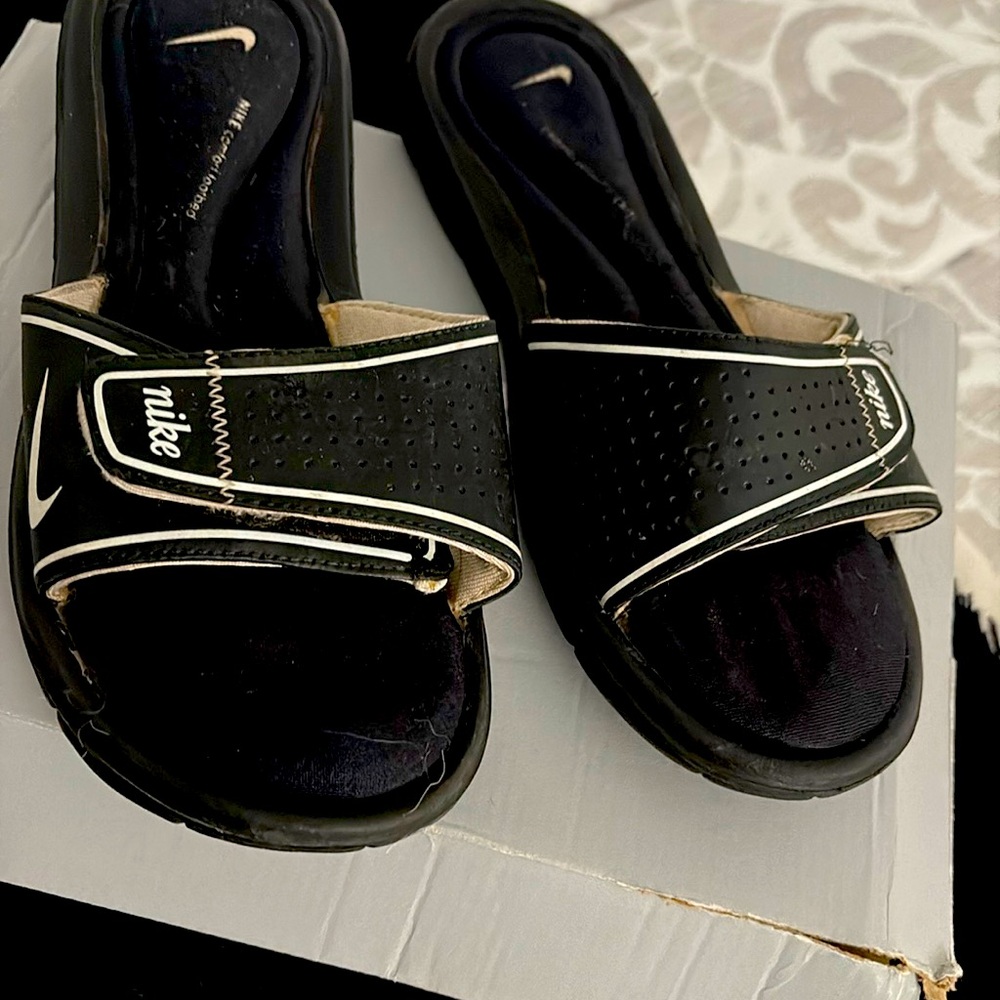 Black and white Nike slides